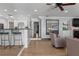 Open living room with hardwood floors and large windows at 1324 Mirror Nw Ter, Winter Haven, FL 33881