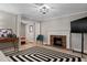 Living room with a fireplace and stylish decor at 1324 Mirror Nw Ter, Winter Haven, FL 33881