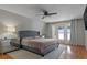 Spacious main bedroom with lake views and hardwood floors at 1324 Mirror Nw Ter, Winter Haven, FL 33881