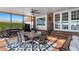 Screened patio with dining area and grill at 1324 Mirror Nw Ter, Winter Haven, FL 33881