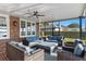 Covered patio with wicker furniture and ceiling fan at 1324 Mirror Nw Ter, Winter Haven, FL 33881