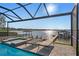 Resort style pool and spa with lake view at 1324 Mirror Nw Ter, Winter Haven, FL 33881