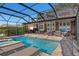 Spacious pool and spa with covered patio at 1324 Mirror Nw Ter, Winter Haven, FL 33881