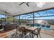 Covered patio with pool, spa, and lake view at 1324 Mirror Nw Ter, Winter Haven, FL 33881