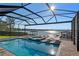 Relaxing pool and spa with lake view at 1324 Mirror Nw Ter, Winter Haven, FL 33881