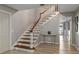 Elegant staircase with wood treads and white risers at 1324 Mirror Nw Ter, Winter Haven, FL 33881