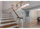 View of a spacious staircase with wooden handrail at 1324 Mirror Nw Ter, Winter Haven, FL 33881