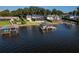 Aerial view of multiple waterfront homes and boat docks at 1324 Mirror Nw Ter, Winter Haven, FL 33881
