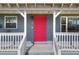 Red front door with multiple square panels at 149 Avenue E Sw, Winter Haven, FL 33880