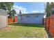 View of backyard, shed, and wooden fence at 149 Avenue E Sw, Winter Haven, FL 33880
