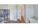 Spacious bedroom with a large pet cage and access to a bathroom at 149 Avenue E Sw, Winter Haven, FL 33880
