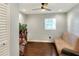 Cozy bedroom with hardwood floors and a built-in storage at 149 Avenue E Sw, Winter Haven, FL 33880