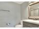 Modern bathroom with gray vanity, a toilet and shower at 149 Avenue E Sw, Winter Haven, FL 33880