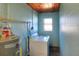 Functional laundry room with washer, dryer, and ample storage at 149 Avenue E Sw, Winter Haven, FL 33880