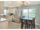 Modern kitchen with white cabinets, stainless steel appliances, and granite countertops at 149 Avenue E Sw, Winter Haven, FL 33880