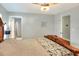 Serene bedroom with large bed, ensuite bathroom access, and ceiling fan at 149 Avenue E Sw, Winter Haven, FL 33880