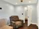 Relaxing living room with a recliner and access to another room at 149 Avenue E Sw, Winter Haven, FL 33880