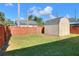 Backyard with shed and wooden fence at 149 Avenue E Sw, Winter Haven, FL 33880