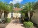 Brick walkway to front door, palm trees at 1561 Vienna Square Dr, Winter Haven, FL 33884