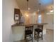 Kitchen with breakfast bar and two stools at 1561 Vienna Square Dr, Winter Haven, FL 33884