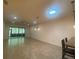 Open living room with tile floors and access to a screened-in patio at 1561 Vienna Square Dr, Winter Haven, FL 33884