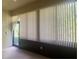 Sunroom with windows, vertical blinds, and access to the outdoors at 1561 Vienna Square Dr, Winter Haven, FL 33884