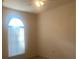 Bright bedroom with window and ceiling fan at 1561 Vienna Square Dr, Winter Haven, FL 33884