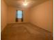 Spacious bedroom with window and ceiling fan at 1561 Vienna Square Dr, Winter Haven, FL 33884