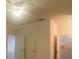 Bedroom with ceiling fan, double closets and access to bathroom at 1561 Vienna Square Dr, Winter Haven, FL 33884