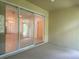 Spacious lanai with sliding glass doors offering views of the interior at 1561 Vienna Square Dr, Winter Haven, FL 33884