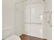 Walk-in shower with grab bars and tiled flooring at 1613 Linz Ct, Winter Haven, FL 33884