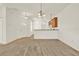 Bright dining room with light carpeting and kitchen bar at 1613 Linz Ct, Winter Haven, FL 33884