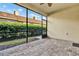 Spacious screened porch with paver patio and ceiling fan at 1613 Linz Ct, Winter Haven, FL 33884
