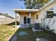 Covered patio with ceiling fan and AC unit at 213 Rhea Cir, Lakeland, FL 33813