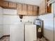 Laundry room with washer, dryer, and ample storage at 221 Dorothy St, Auburndale, FL 33823
