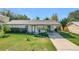 Single-story home with a carport and well-maintained lawn at 221 Dorothy St, Auburndale, FL 33823