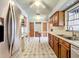Open kitchen with stainless steel appliances and tiled floor at 221 Dorothy St, Auburndale, FL 33823