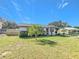 Charming one-story house with a spacious front yard at 221 Dorothy St, Auburndale, FL 33823