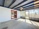 Spacious screened porch with ceiling fan and outdoor access at 221 Dorothy St, Auburndale, FL 33823