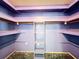 Large walk-in closet with shelving and hanging rod at 221 Dorothy St, Auburndale, FL 33823