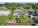 House with fenced backyard, palm trees, and detached shed at 221 Dorothy St, Auburndale, FL 33823