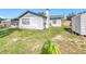 Simple backyard with a shed at 221 Dorothy St, Auburndale, FL 33823