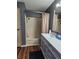 Bathroom with tub and modern vanity at 312 Douglas Park Ave, Davenport, FL 33897
