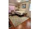 Cozy bedroom with a comfortable bed and plenty of floor space at 312 Douglas Park Ave, Davenport, FL 33897