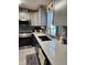 Modern kitchen with updated cabinets, countertops, and stainless steel appliances at 312 Douglas Park Ave, Davenport, FL 33897