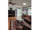 Living room showcasing a comfortable seating arrangement and hardwood flooring at 312 Douglas Park Ave, Davenport, FL 33897
