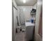 Convenient laundry room with washer, dryer, and shelving at 312 Douglas Park Ave, Davenport, FL 33897