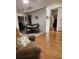 Dining area featuring a wooden table with four chairs, situated near the living room at 312 Douglas Park Ave, Davenport, FL 33897