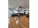 Spacious living room with hardwood floors, ample seating, and a ceiling fan at 312 Douglas Park Ave, Davenport, FL 33897