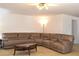 Spacious living room featuring a large sectional sofa and coffee table at 364 Fish Hawk Dr, Winter Haven, FL 33884